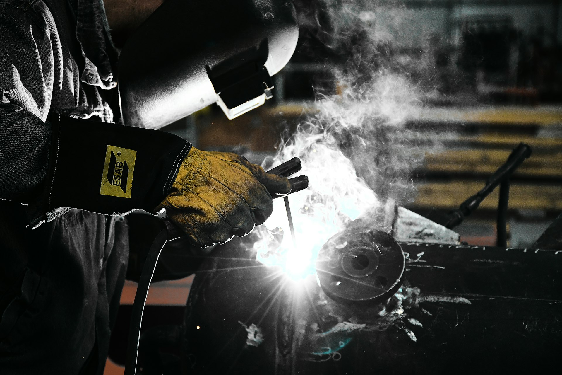 A welder working on a piece of metal